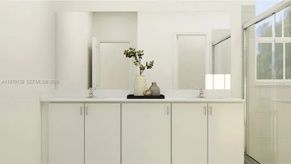 a bathroom with a sink and mirror