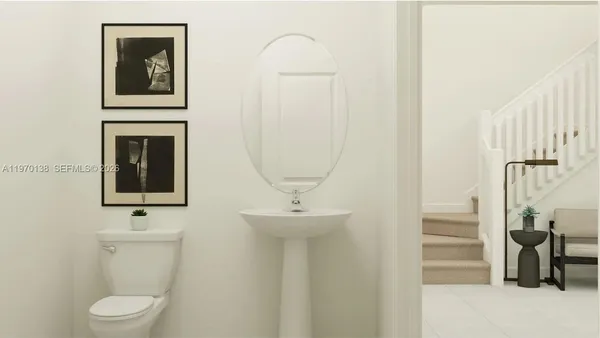 a bathroom with a sink mirror and toilet