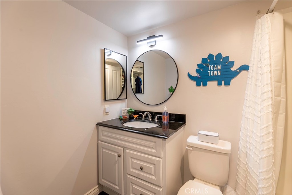 20702 El Toro Road, Unit 178 Lake Forest, CA 92630 - Photo 16 of 30 a bathroom with a sink and a mirror