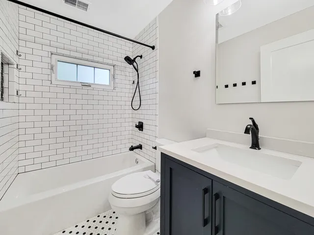 a bathroom with a sink a toilet and a bathtub
