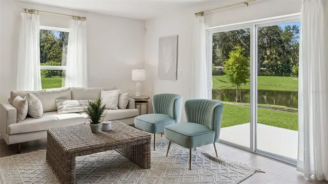 a living room with furniture and a window