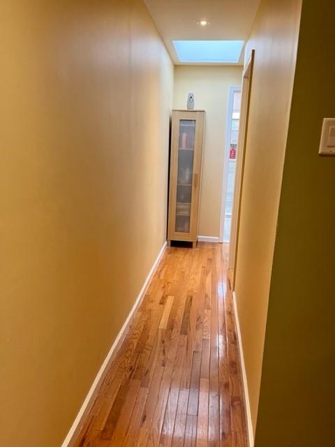 1717 East 37th Street Brooklyn, NY 11234 - Photo 11 of 12 a view of utility room with wooden floor