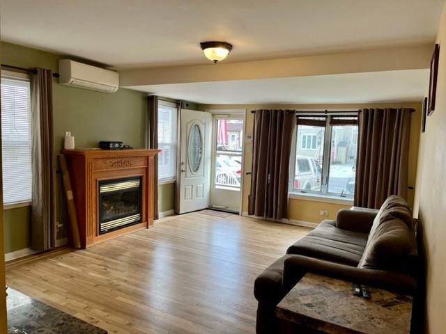 1717 East 37th Street Brooklyn, NY 11234 - Photo 3 of 12 a living room with furniture and a fireplace