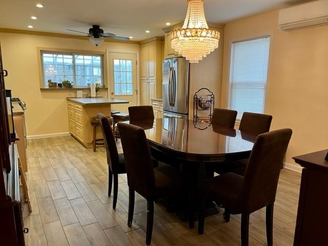 1717 East 37th Street Brooklyn, NY 11234 - Photo 4 of 12 a view of a dining room with furniture and a chandelier