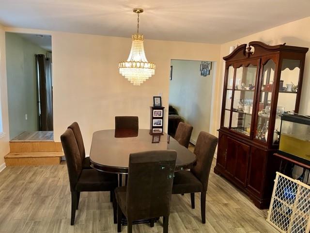 1717 East 37th Street Brooklyn, NY 11234 - Photo 5 of 12 a view of a dining room with furniture window and wooden floor