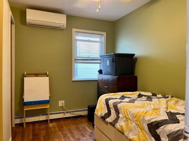 1717 East 37th Street Brooklyn, NY 11234 - Photo 8 of 12 a bedroom with a bed and a window