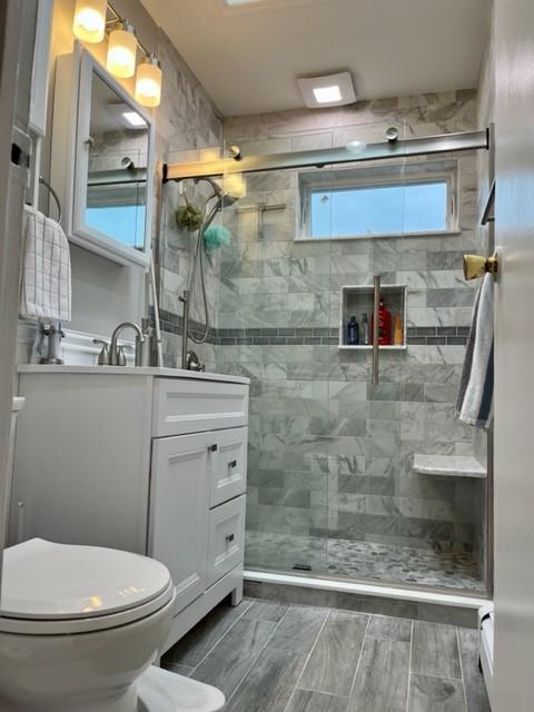 1717 East 37th Street Brooklyn, NY 11234 - Photo 9 of 12 a bathroom with a toilet sink and shower