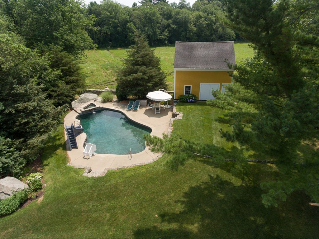 272 Marys Pond Road Rochester, MA 02770 - Photo 13 of 30 an aerial view of a house with pool yard and outdoor seating