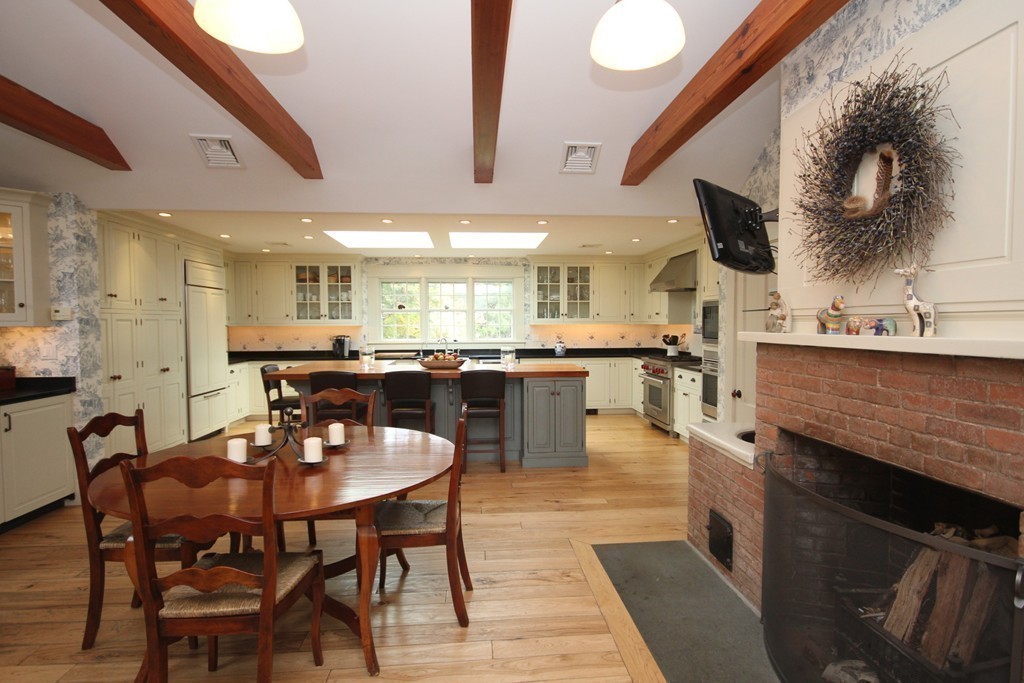 272 Marys Pond Road Rochester, MA 02770 - Photo 20 of 30 a kitchen with a table and chairs in it