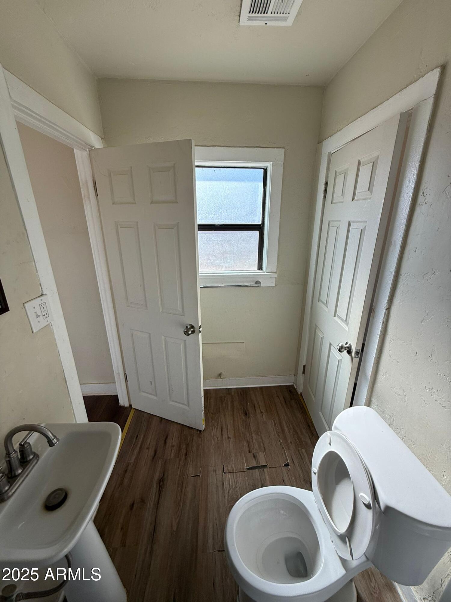 2082 North Cougar Place Douglas, AZ 85607 - Photo 11 of 16 a bathroom with a sink and a mirror