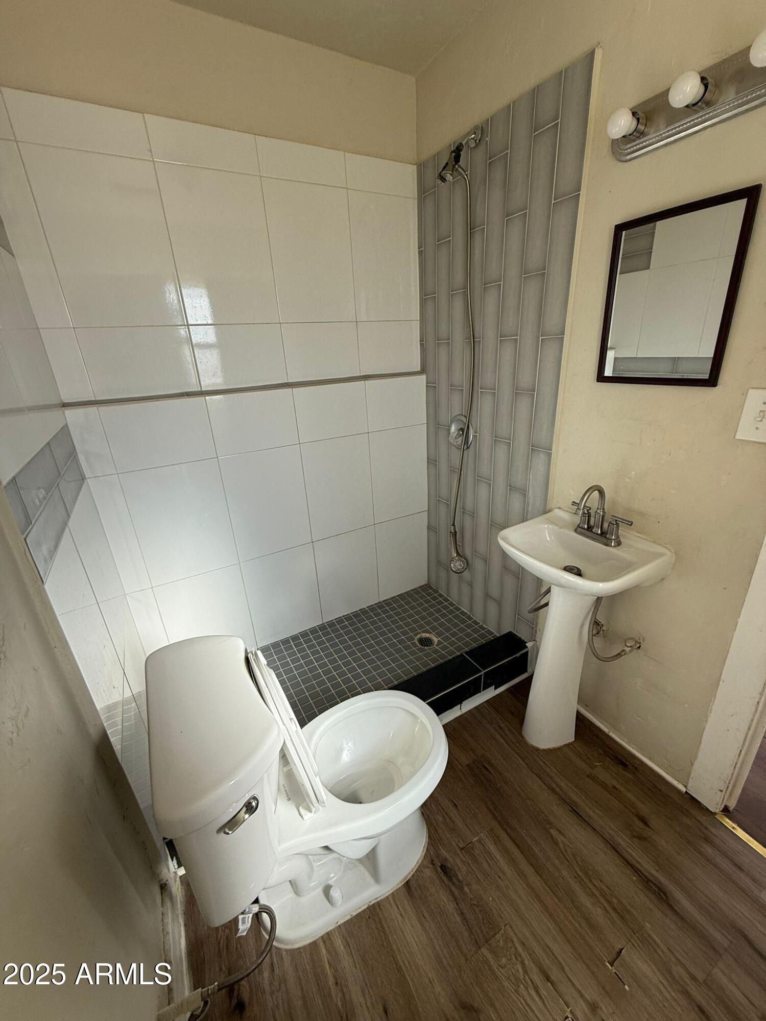 2082 North Cougar Place Douglas, AZ 85607 - Photo 12 of 16 a bathroom with a sink and a mirror
