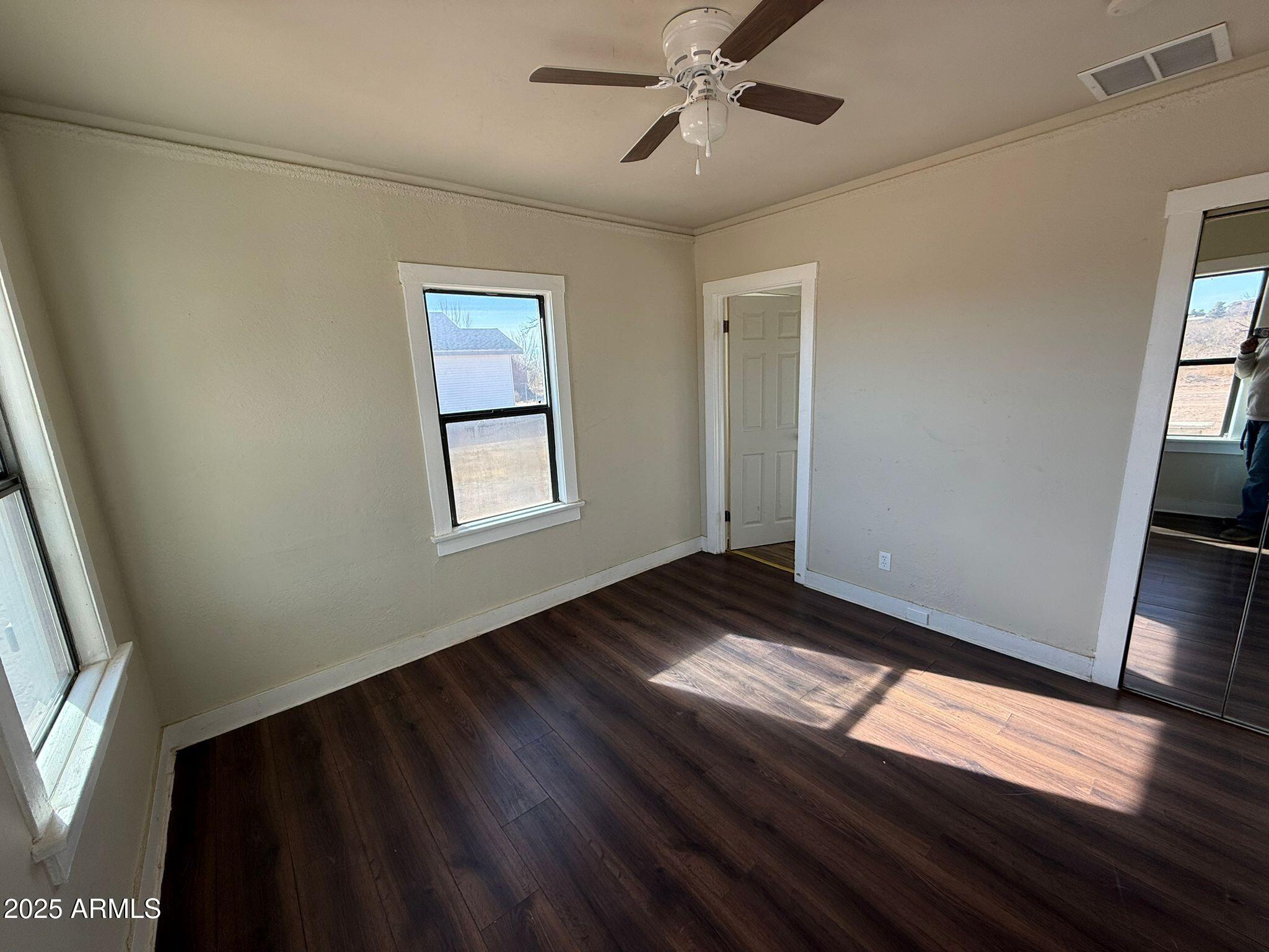 2082 North Cougar Place Douglas, AZ 85607 - Photo 14 of 16 a view of an empty room and wooden floor
