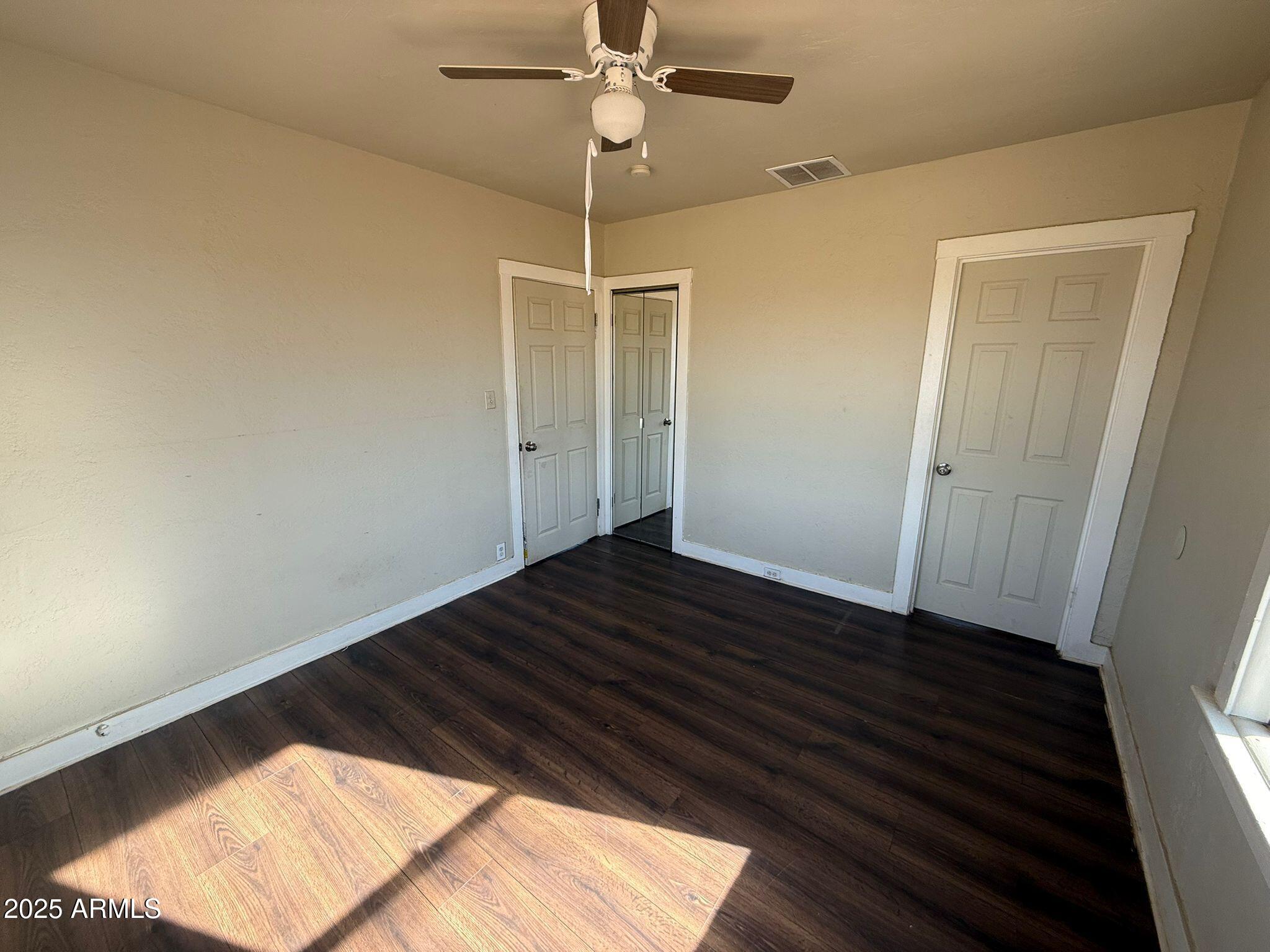 2082 North Cougar Place Douglas, AZ 85607 - Photo 9 of 16 a view of a hallway with wooden floor