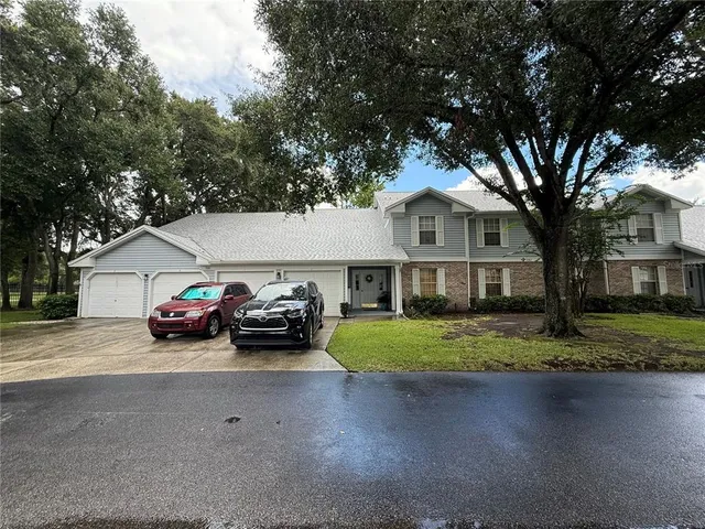 a view of a car in front of a house