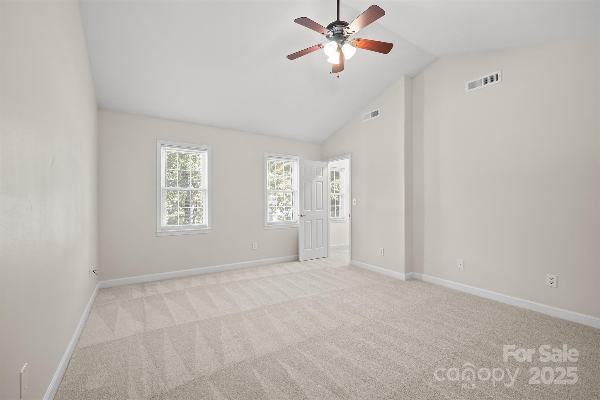 3024 Cross Tie Lane Matthews, NC 28105 - Photo 11 of 30 an empty room with windows and fan