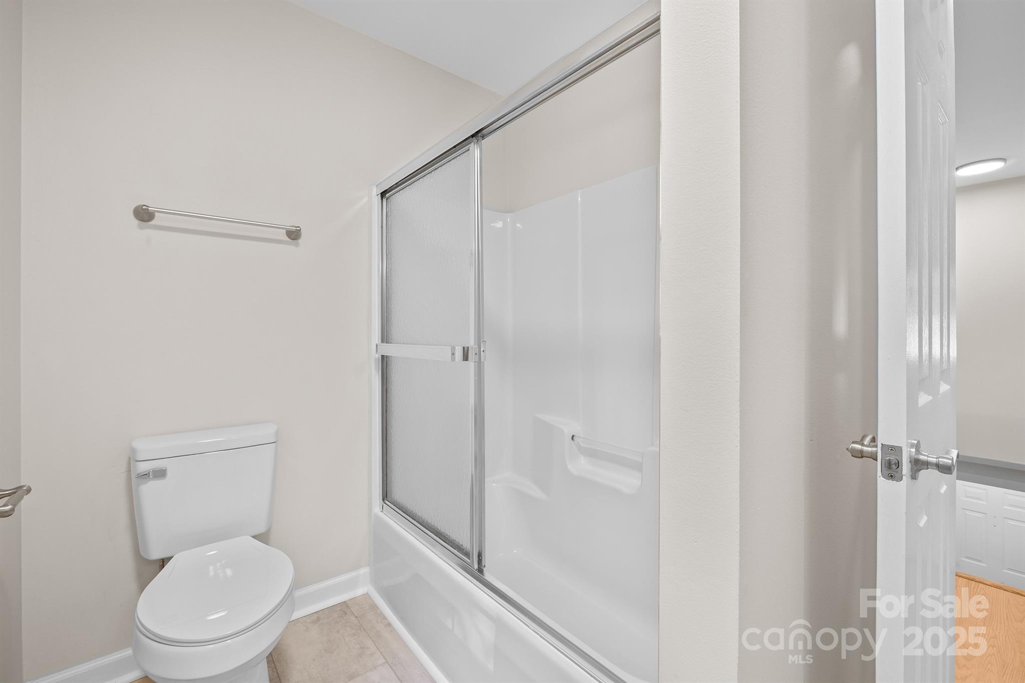 3024 Cross Tie Lane Matthews, NC 28105 - Photo 15 of 30 a white toilet sitting next to a shower