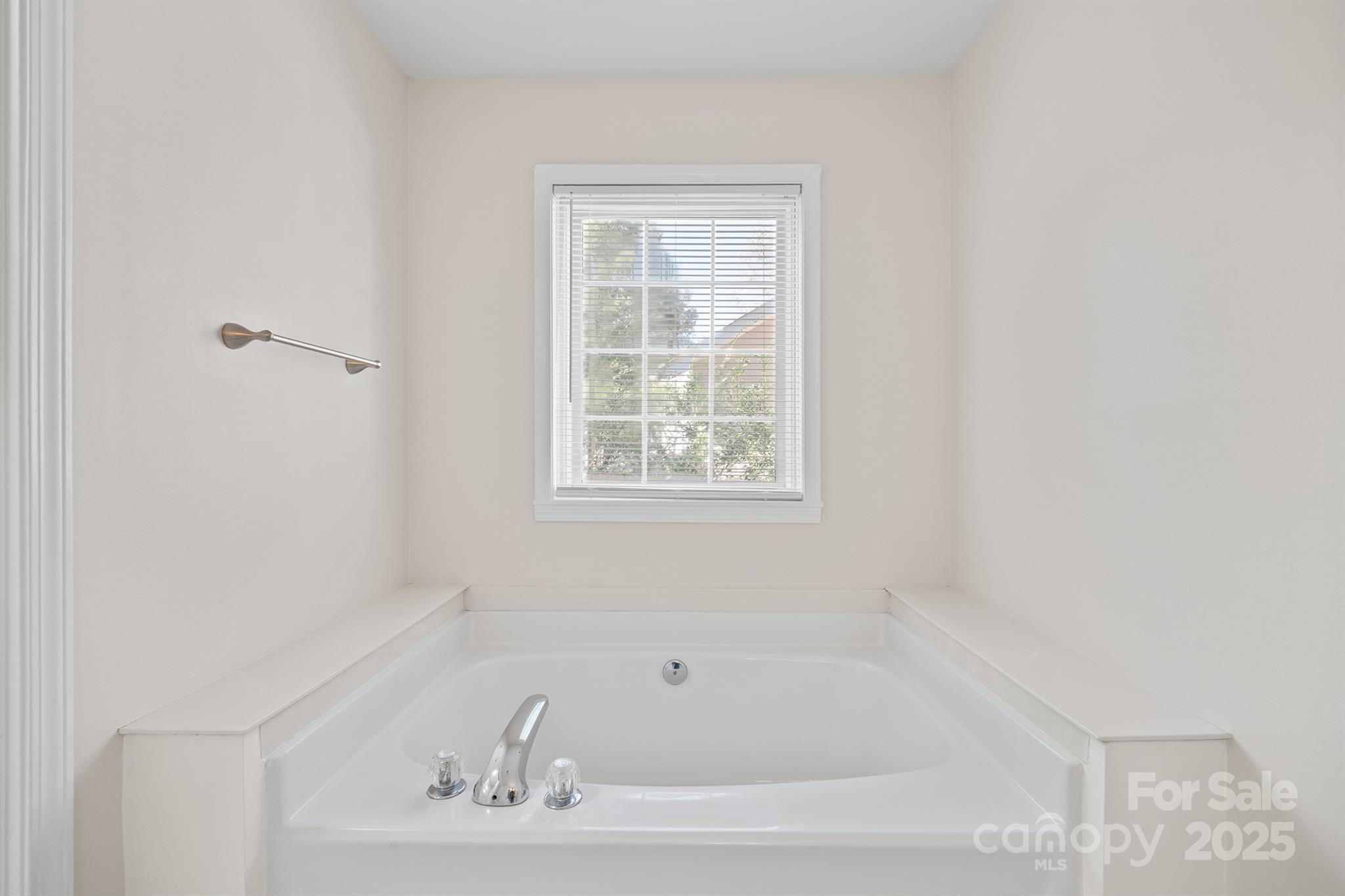 3024 Cross Tie Lane Matthews, NC 28105 - Photo 23 of 30 a white bath tub sitting next to a window
