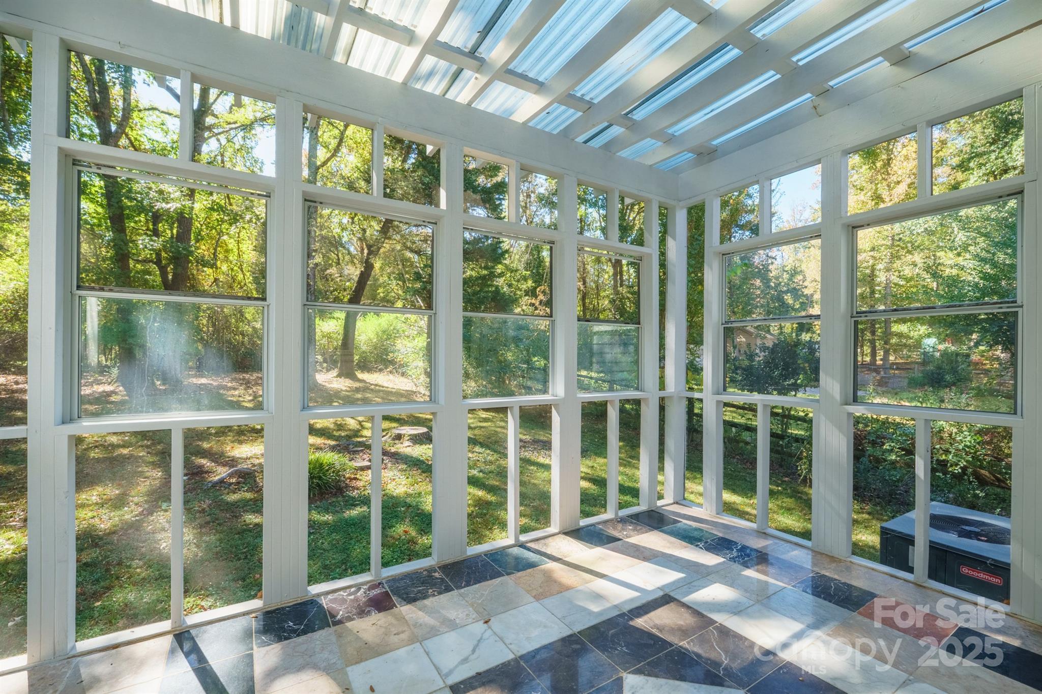 3024 Cross Tie Lane Matthews, NC 28105 - Photo 28 of 30 a view of a big room with wooden floor and windows