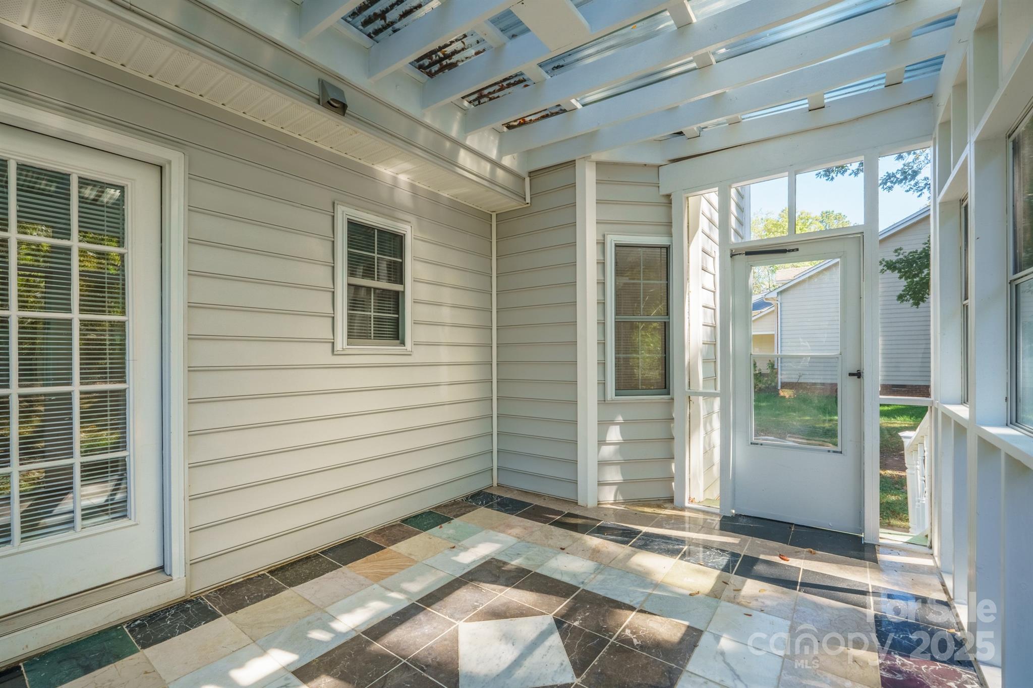 3024 Cross Tie Lane Matthews, NC 28105 - Photo 29 of 30 a view of a porch with a door