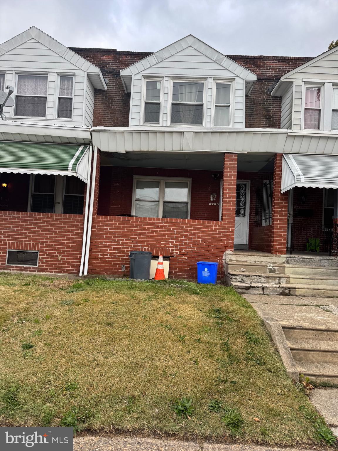 2709 South 70th Street Philadelphia, PA 19142 - Photo 3 of 4 a view of a house with many windows and yard