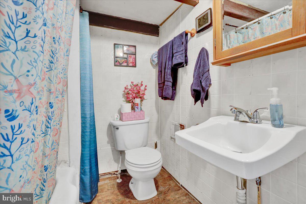 279 Furnace Road Birdsboro, PA 19508 - Photo 12 of 20 a bathroom with a toilet sink and mirror