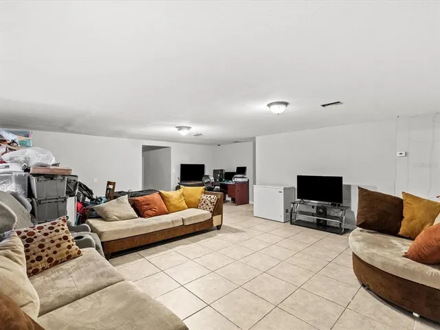 a living room with furniture and a couch