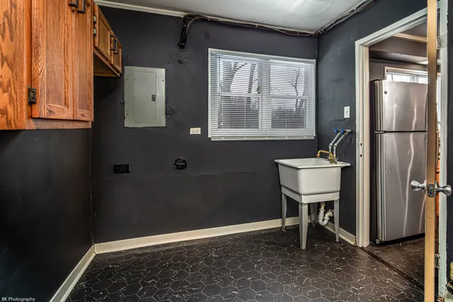 a bathroom with a sink a toilet and a window