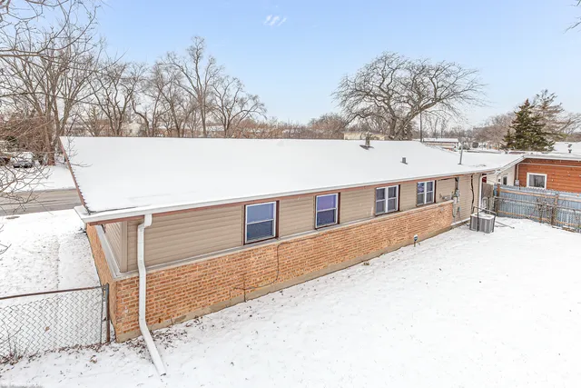a house that has a tree in front of it