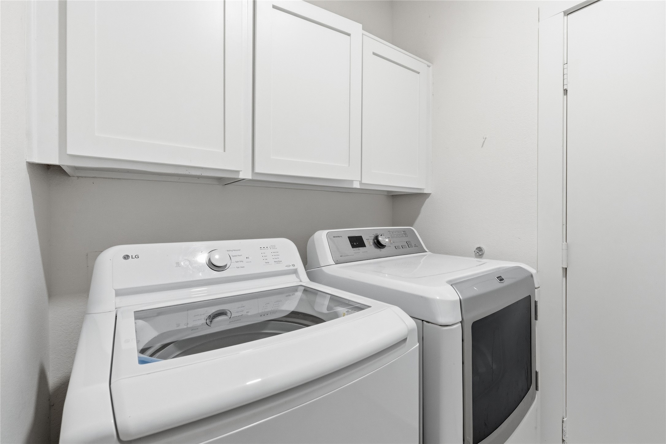 6310 Walebridge Lane Austin, TX 78739 - Photo 32 of 40 A real laundry room! Not a closet! Lots of space to hang clothes on the other side of this wall.