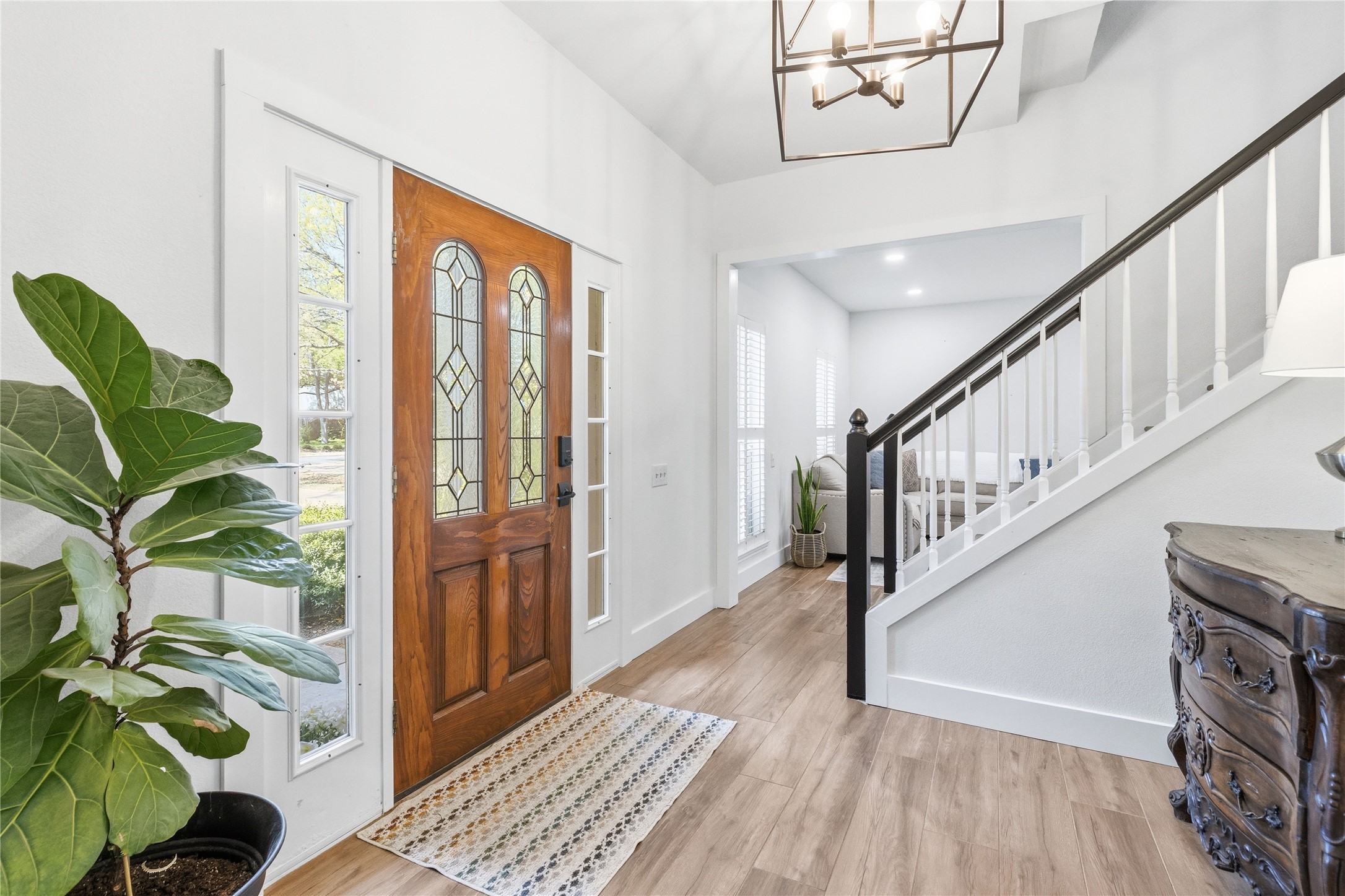 6310 Walebridge Lane Austin, TX 78739 - Photo 8 of 40 Entrance foyer with light wood-style flooring and suspended lighting.