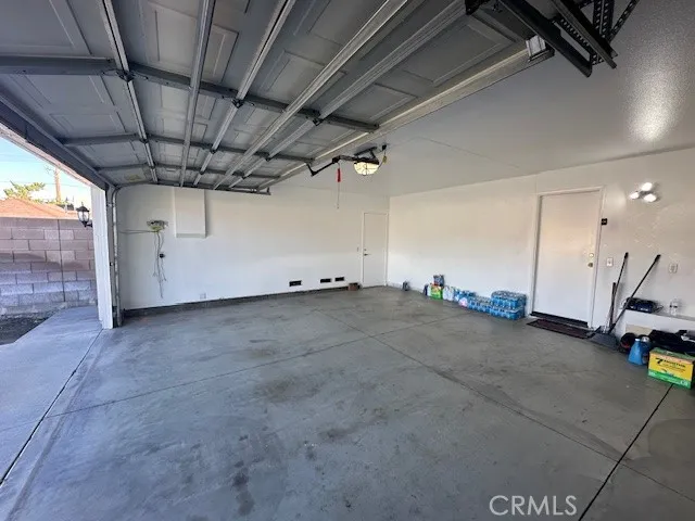 a view of a hallway with a potted plant