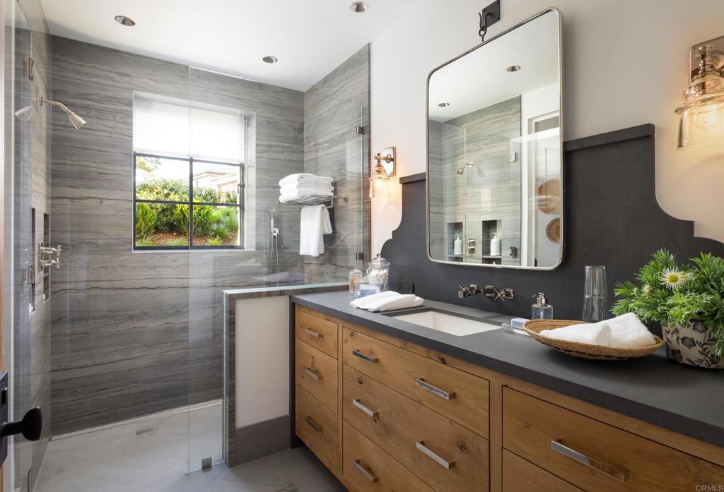 17845 Via De Fortuna Rancho Santa Fe, CA 92067 - Photo 38 of 45 a bathroom with a double vanity sink mirror and shower
