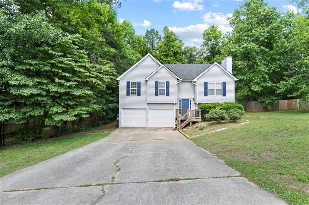 251 Cedars Glen Circle Villa Rica, GA 30180 - Photo 1 of 1 a front view of a house with a yard and trees
