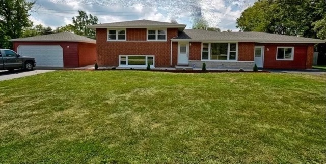 8620 Wolf Road Willow Springs, IL 60480 - Photo 2 of 32 a front view of a house with a yard