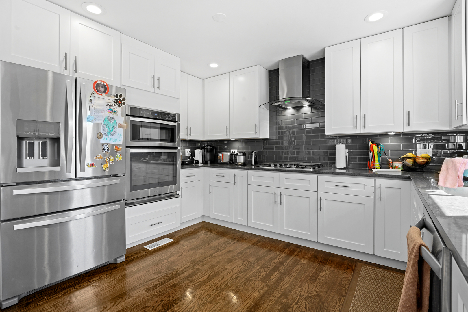 8620 Wolf Road Willow Springs, IL 60480 - Photo 15 of 32 a kitchen with kitchen island granite countertop a stove cabinets and refrigerator