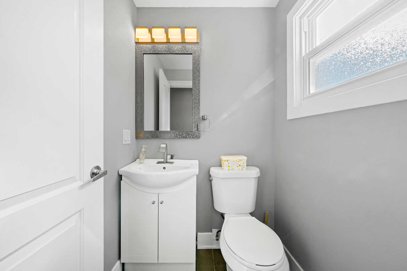 8620 Wolf Road Willow Springs, IL 60480 - Photo 17 of 32 a bathroom with a toilet sink and mirror
