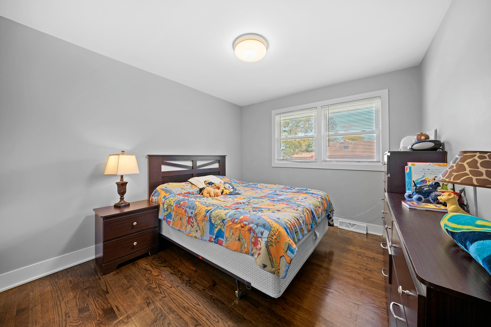 8620 Wolf Road Willow Springs, IL 60480 - Photo 18 of 32 a bedroom with a bed and window