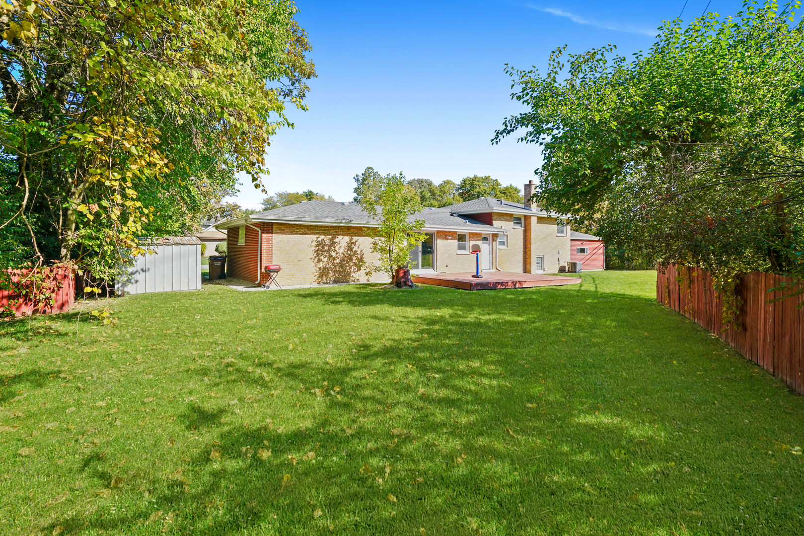8620 Wolf Road Willow Springs, IL 60480 - Photo 32 of 32 a view of a house with a big yard and large trees