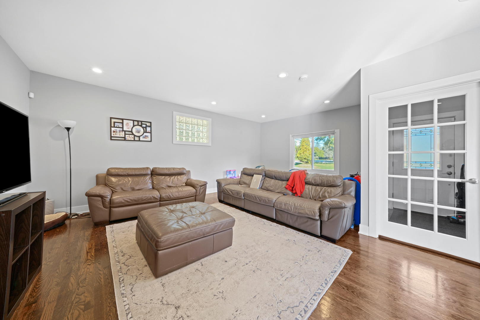 8620 Wolf Road Willow Springs, IL 60480 - Photo 8 of 32 a living room with furniture and a flat screen tv