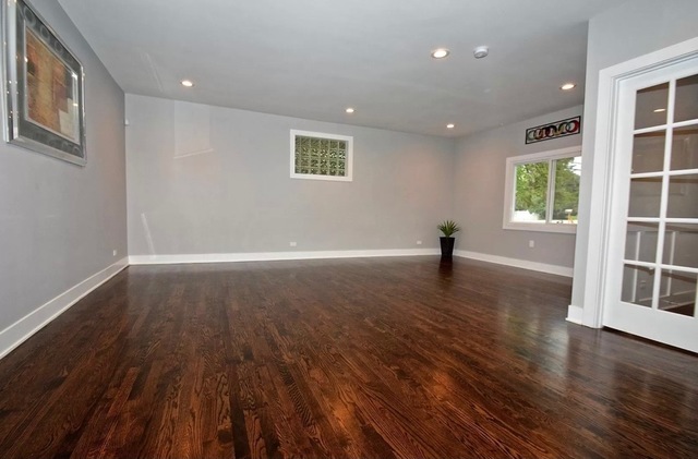 8620 Wolf Road Willow Springs, IL 60480 - Photo 10 of 32 a view of empty room with wooden floor and fan