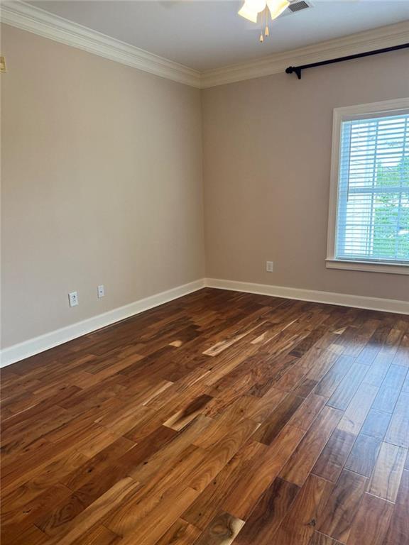 2310 Village Boulevard Southeast Rome, GA 30161 - Photo 13 of 15 an empty room with wooden floor and windows
