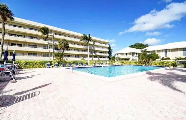a view of building with swimming pool