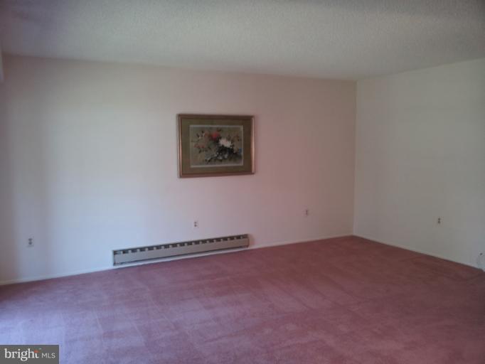 15100 Glade Drive, Unit 112E Silver Spring, MD 20906 - Photo 18 of 25 a view of a room with an empty space
