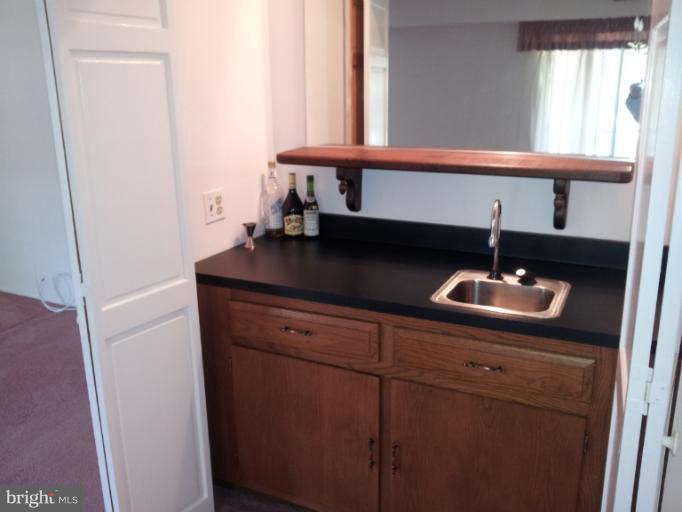 15100 Glade Drive, Unit 112E Silver Spring, MD 20906 - Photo 22 of 25 a kitchen with a sink and a window