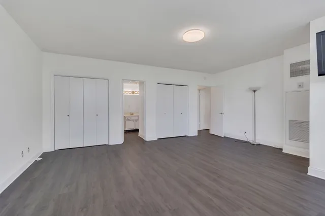 a view of a swimming pool with a patio and a garden