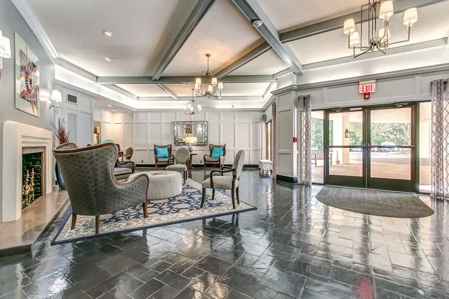 a view of a park with large trees