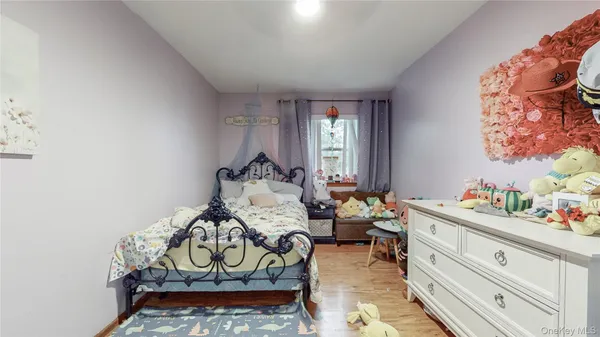 a bed room with furniture and a window