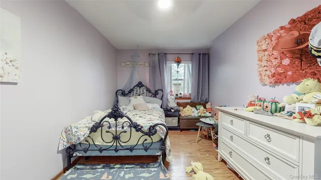 a bed room with furniture and a window