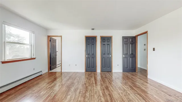 a view of livingroom with hardwood floor and hallway