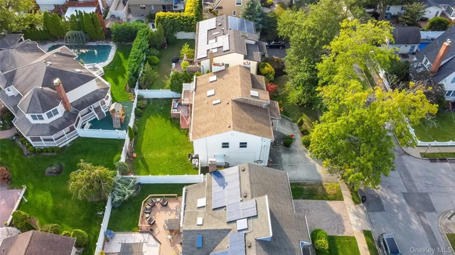 an aerial view of multiple houses with outdoor space